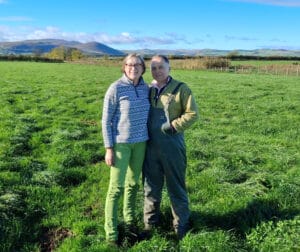 Jackie and Neil Maxwell in a field at Doddington Dairy