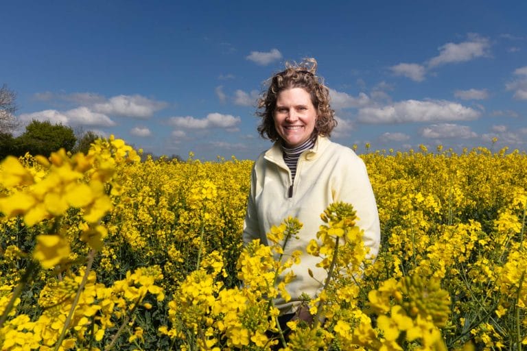 Sarahl Bell stood in a field of oilseed rape