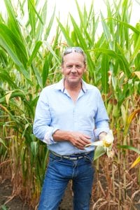 Paul Phillips holding a maize cob.