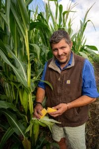 Ben Burgess holding Harmony maize